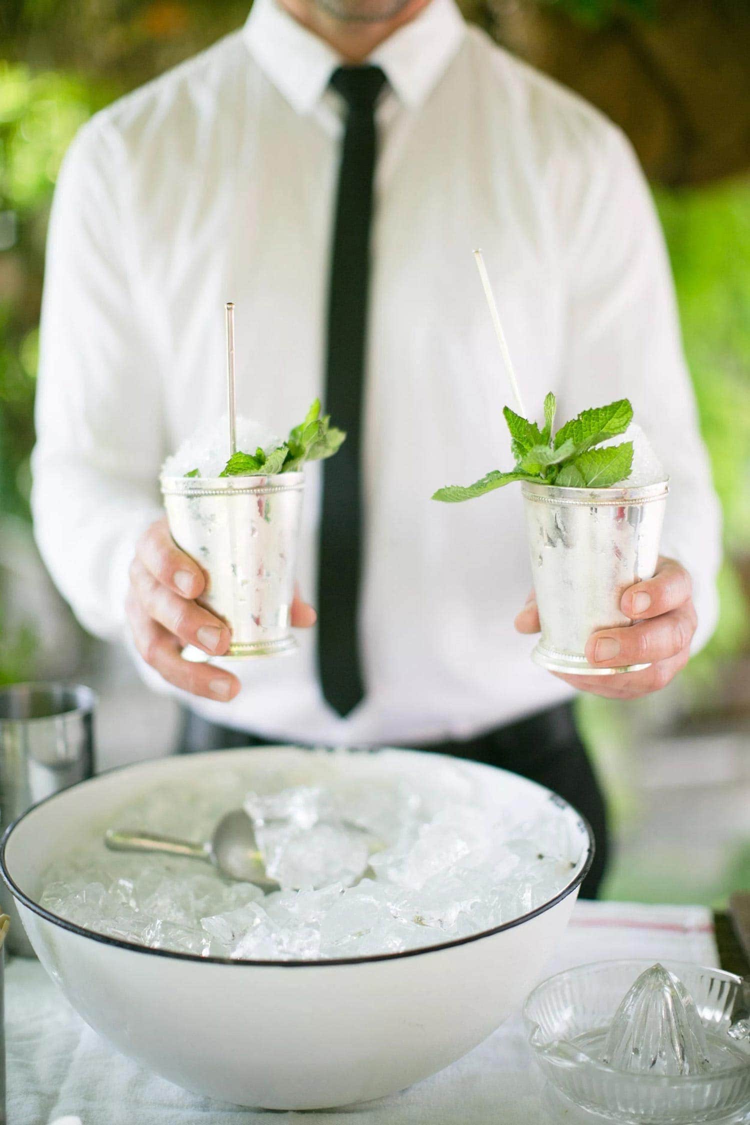 Summer Drink Recipes Mint Juliep bartender holding | Lisa Dupar Catering | Wedding & Event Catering in Seattle