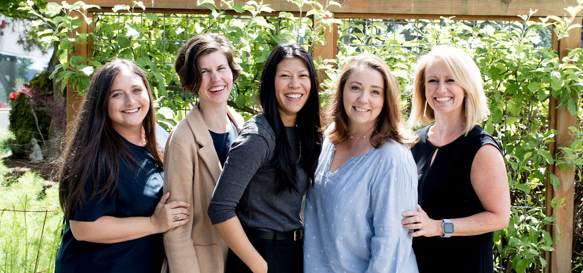 5 women smiling in a garden | Lisa Dupar Catering | Wedding & Event Catering in Seattle