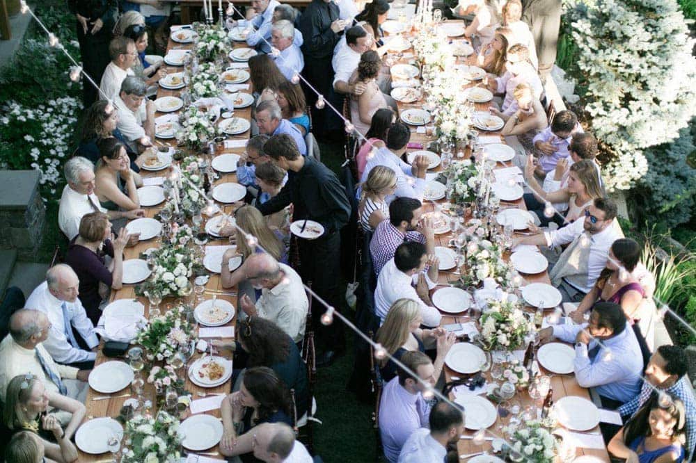 Two tables full of people eating | Lisa Dupar Catering | Wedding & Event Catering in Seattle