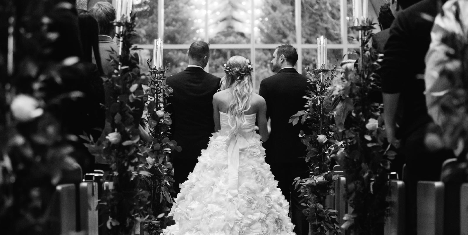 A bride standing between two men | Lisa Dupar Catering | Wedding & Event Catering in Seattle