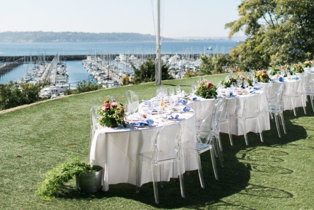 Serpentine table on a lawn overlooking the water | Lisa Dupar Catering in Seattle, WA